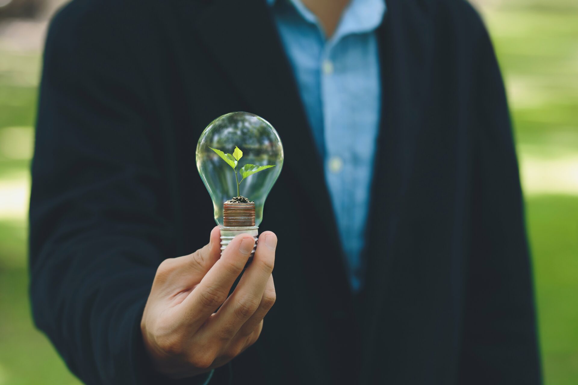 business owner holding a light bulb with alternatives to business loans.