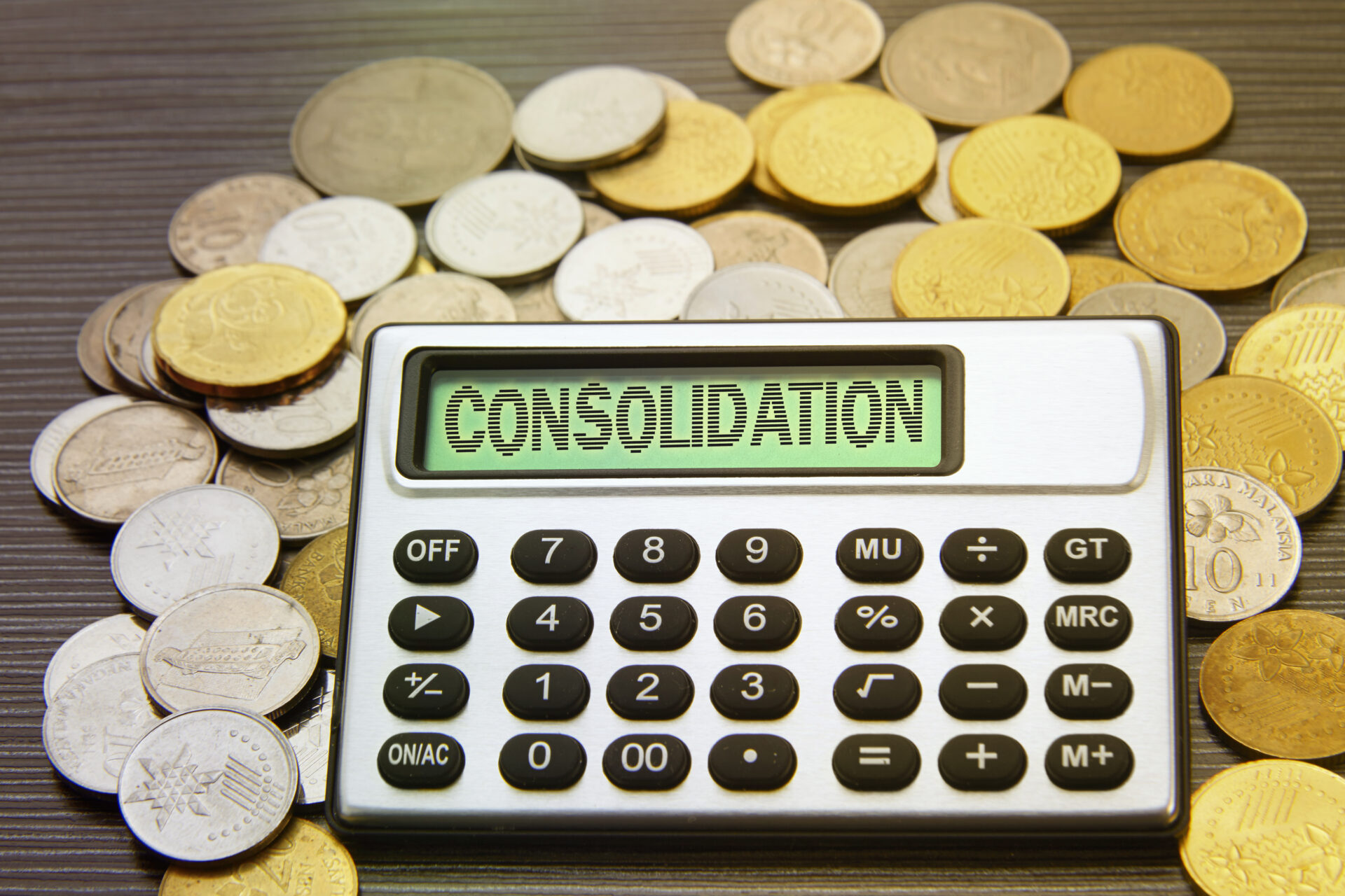 calculator with money around labeled consolidation for a term loan.