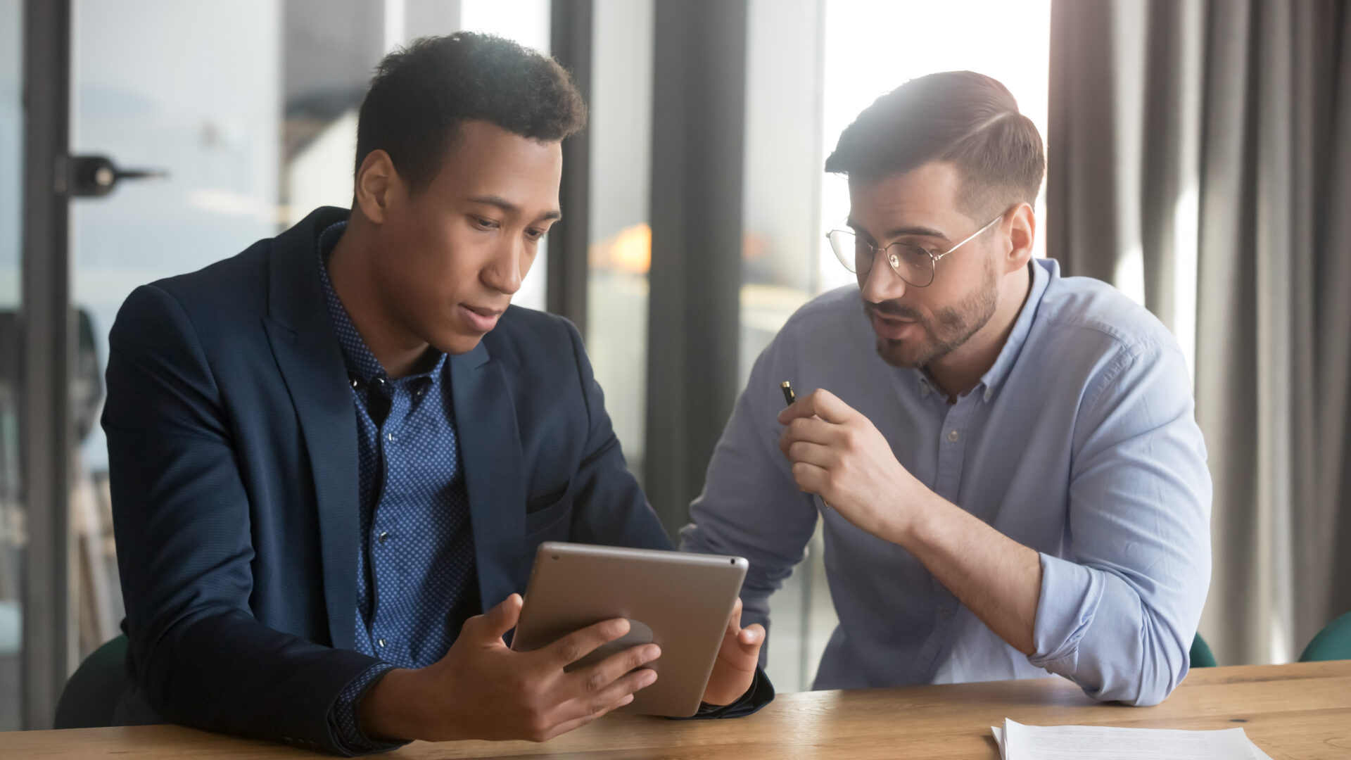 two business men having a conversation about equipment financing